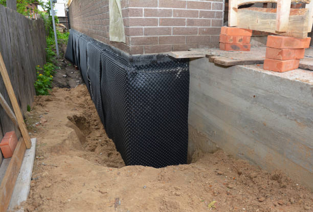 SJ Waterproofing Pros technician performing targeted Foundation Crack Repair assessment in West College Corner, IN